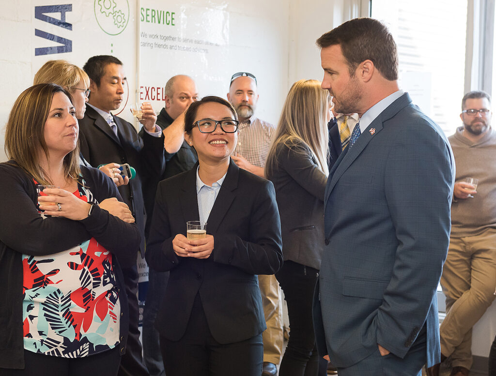 3 business people chatting at a gathering