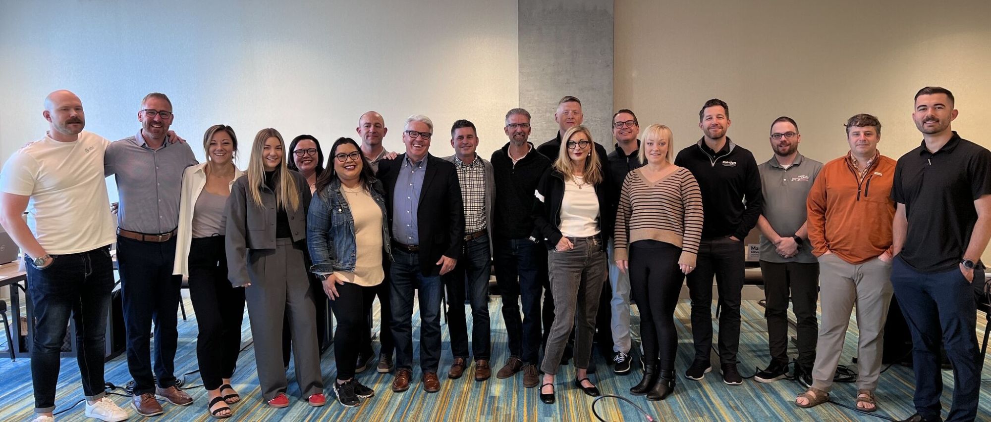 A group photo of the NCM team standing in a line