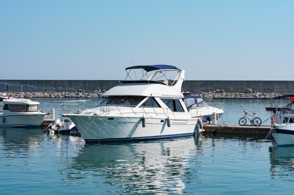 a small yacht is docked in a pier
