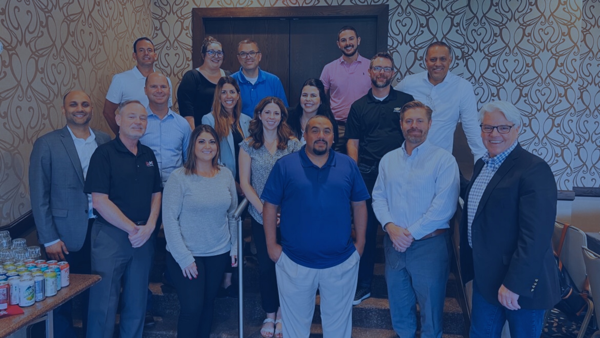 a group photo of powersports dealers at their 20 group meet up